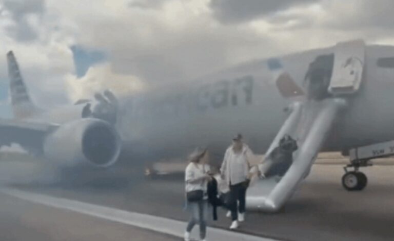 Panic on Denver Airport runway: American Airlines aborts takeoff after gear malfunction; video shows passengers fleeing down slides as smoke engulfs plane